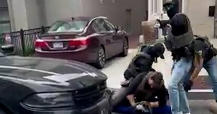 Video shows masked law enforcement arresting man in Washington, D.C.