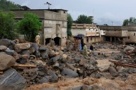 Pakistan reopens roads to areas where flash floods killed over 300