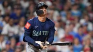 Phillies' bats overpower Mariners in 12
