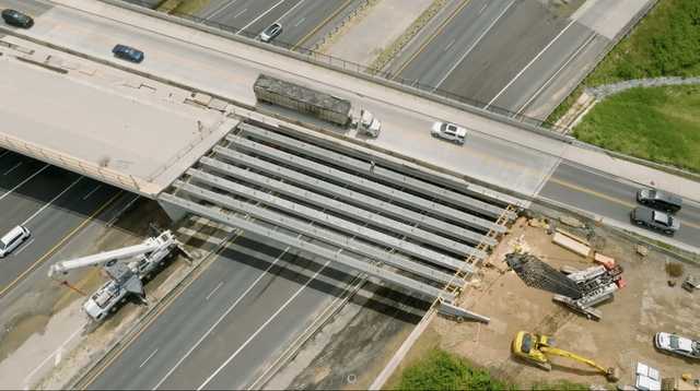 Bridge beams installed at the Exit 18 overpass. What’s next for the project?