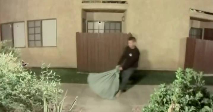 Husband of dead woman seen dragging bag with large object