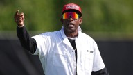 Colorado coach Deion Sanders wants pay equality in the College Football Playoff. Here’s his proposal