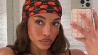 Lori Harvey stuns in busty black bikini for mirror selfie on extravagant trip to Ibiza