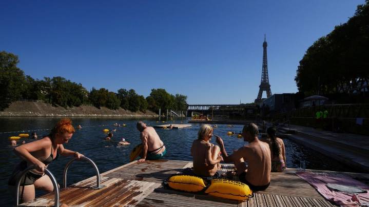 The Seine in Paris is open for swimming. Tourists and residents embrace it as temperatures soar
