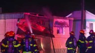 Des Moines firefighters battle flames at mobile home