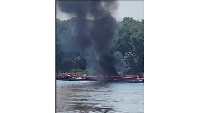 Two die when helicopter crashes into a barge in the Mississippi River