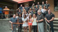 Dallas Hooters reopens, honors injured firefighter