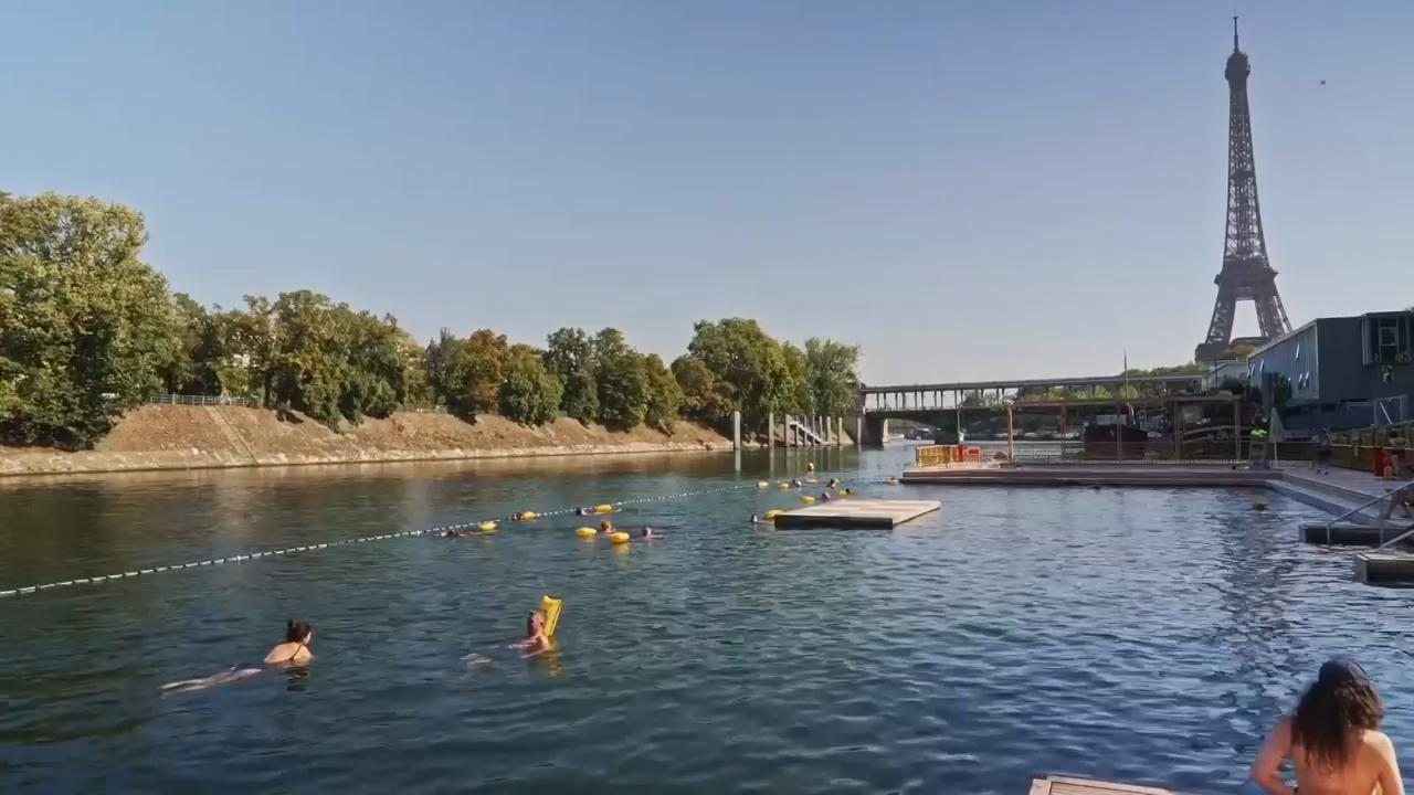 Parisians and tourists flock to swim in the Seine as temperatures soar