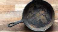 The Unexpected Potato Hack That'll Do Wonders For Your Dirty Cast Iron Skillet