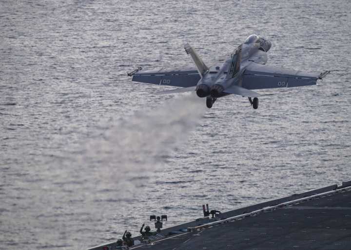 Pilot rescued after U.S. fighter jet crashes off coast of Virginia