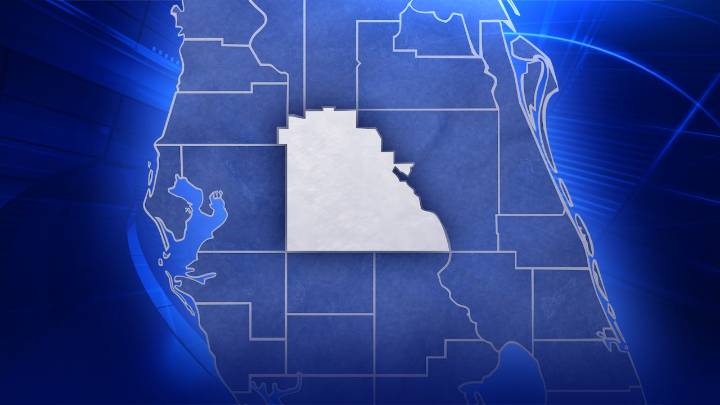 Semi-truck crash in Polk County spills wood across road, sends driver to hospital