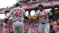 Winn drives in 3 runs, Cardinals take advantage of De La Cruz's error in 10th for 7