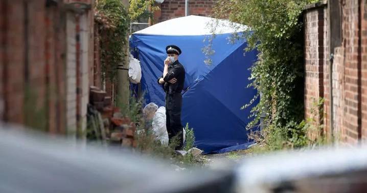 Man arrested on suspicion of manslaughter after body found in Moss Side alleyway