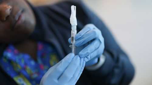 FDA approves updated Covid-19 vaccines for limited groups as US cases continue to rise