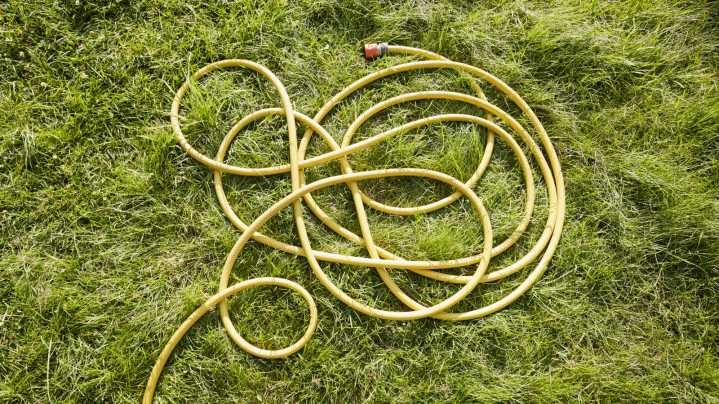 Repurpose A Common Thrift Store Find To Make Your Garden Hose Less Of An Eyesore