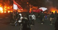 3 dead after mob sets fire to Indonesian regional parliament building