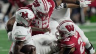 Defense helps Badgers scuffle to season