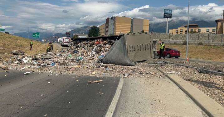 I-15 semi rollover spills trash all over Orem on