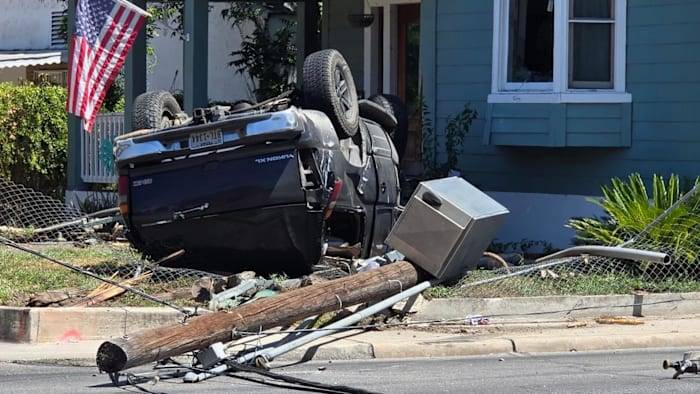 Car crashes into power line, causing road closure on South Side