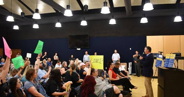 Protestors heckle Barry Moore during town hall