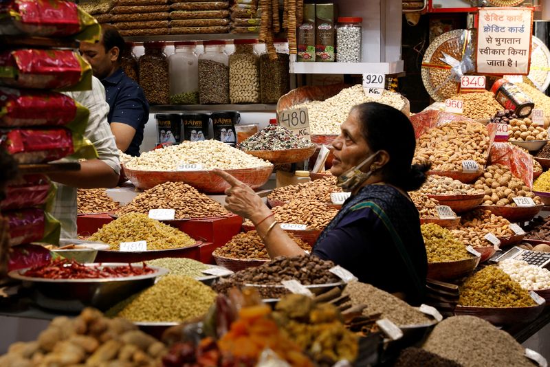 India rate panel says US tariffs key drag on growth, flags benign inflation outlook