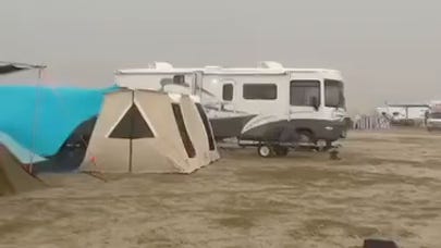 Rain and wind hit the playa at Burning Man 2025