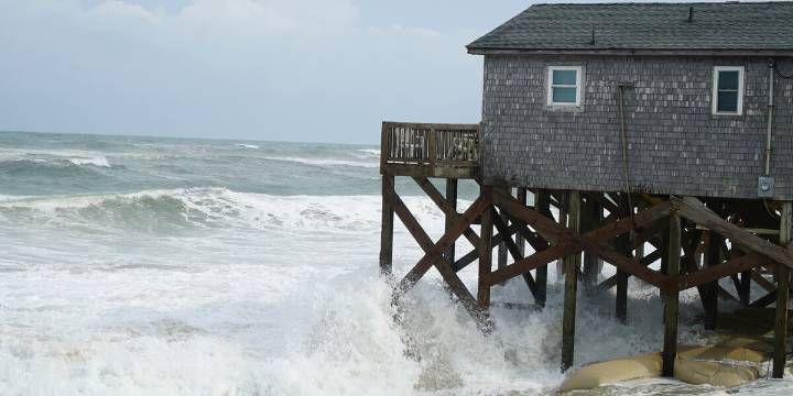 Hurricane Erin stirs up strong winds and floods part of a NC highway as it slowly moves out to sea