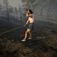 Spain suffers third wildfire death, Greece beats back flames