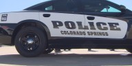 Car crashes into Colorado Springs police cruiser after rocks and concrete spill on I