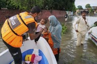 Flash floods leave 32 dead in Indian-controlled Kashmir as over 150,000 are displaced in Pakistan