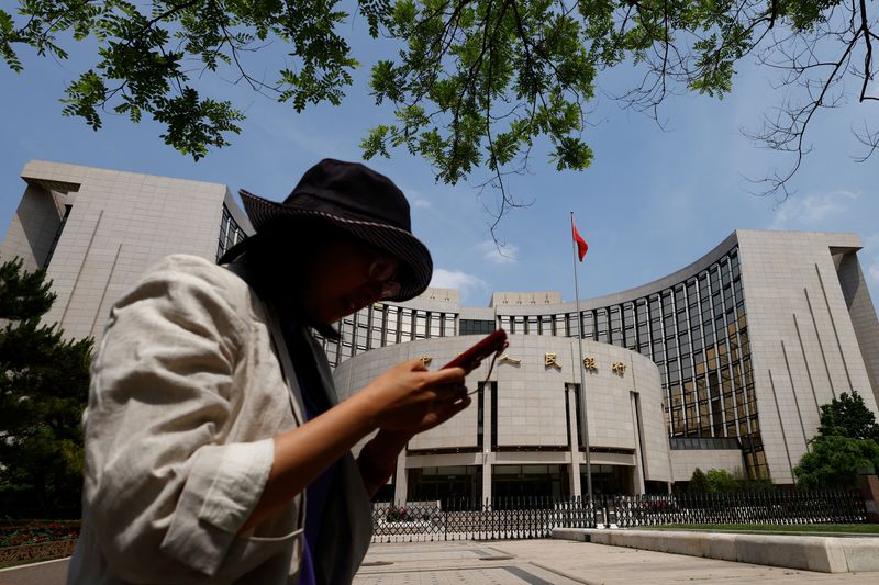 China leaves benchmark lending rates unchanged, matching forecast
