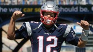 Jets fans catch a stray from Tom Brady during Patriots’ statue ceremony