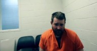 Man accused of killing 2 police officers sobs during first court appearance