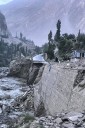 Flash floods triggered by heavy rains kill at least 49 people in northwestern Pakistan