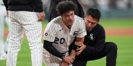 Miguel Vargas exits game after collision at first