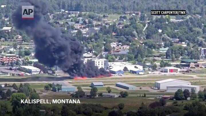 Plane crashes into parked aircraft while landing at Montana airport, sparking fire