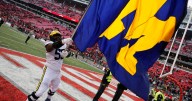 Michigan football fined 10s of millions of dollars, Moore suspended 3 games in sign