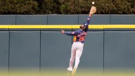 Ex-Mariners OF Trammell crashes into fence in Astros game