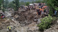 Flash floods triggered by torrential rains kill at least 120 people in India and Pakistan