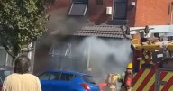Road closed off and emergency services called after house erupts into flames