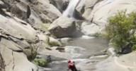 Missing man found ALIVE after spending two days on cliff trapped behind waterfall