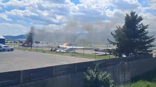 Plane crashes into parked aircraft while landing at Montana airport, sparking fire