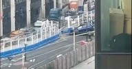 Car crashed into building site in Manchester city centre