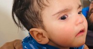 Parents arrested for murder of baby 'kidnapped when mum was attacked at shop'