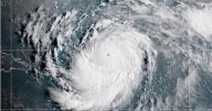 Hurricane Erin weakens to Category 3 as forecasters wait for northward turn