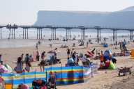 UK faces risk of thunderstorms but heatwave will continue into the weekend