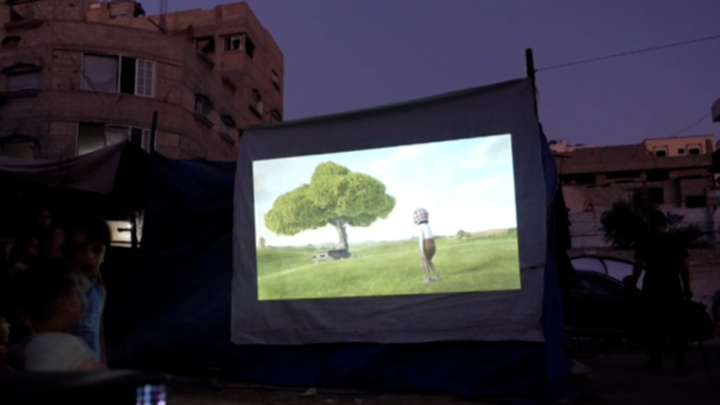 Makeshift cinema camp gives children temporary escape from war in Gaza