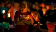 Hundreds honor 2 children killed and 17 people wounded in shooting at a Minneapolis Catholic school
