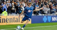 Robin Lod scores a goal for Minnesota in 1