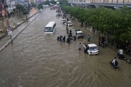 Pakistan restores electricity and reopens roads in areas where floods killed over 300